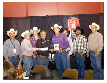 John Vinchot and Billy Jaynes accept buckle for Studly win at NBBA finals